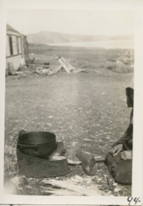 Image of Eskimo [Inuk] with cooking pot
